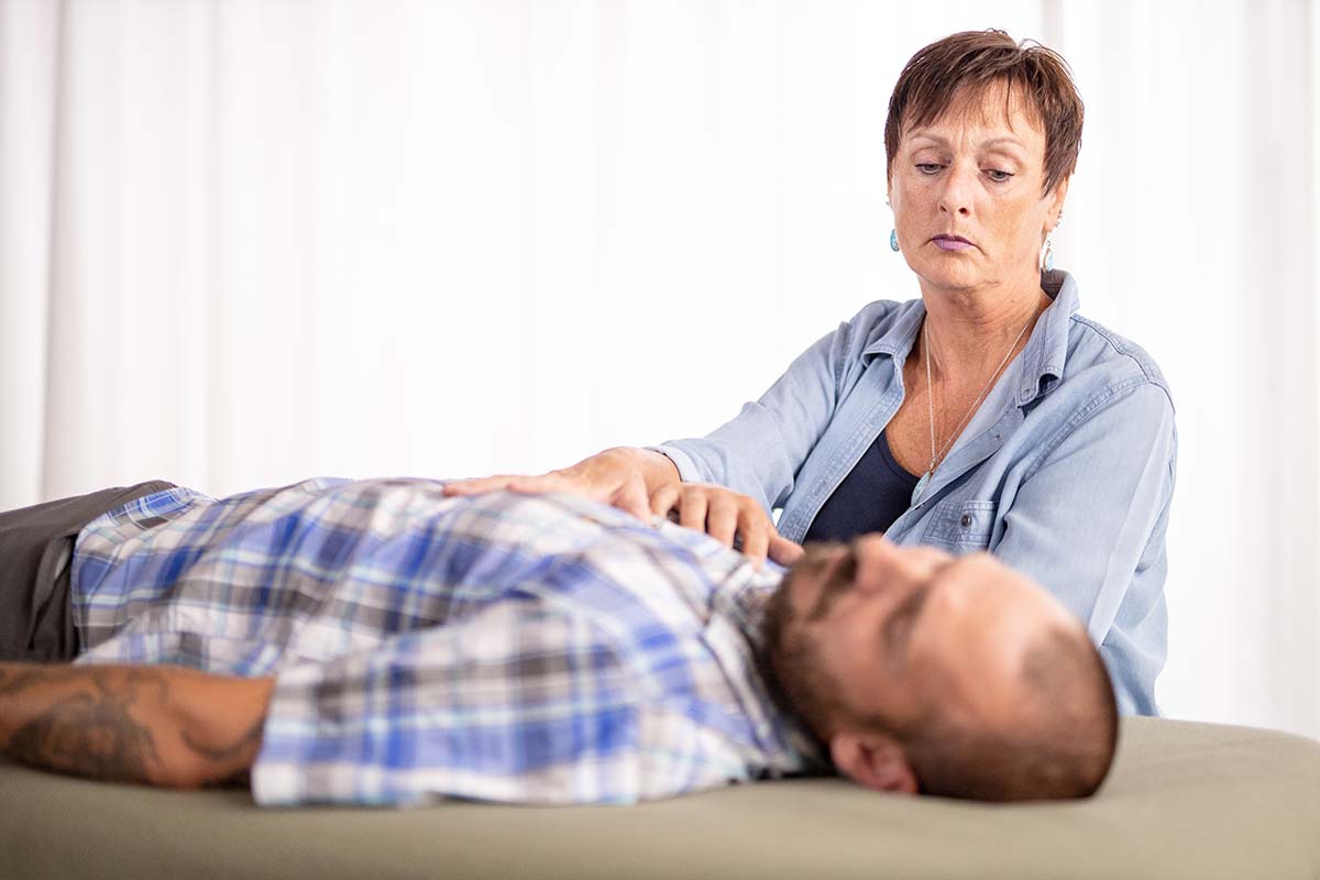 Kim Nedrow doing craniosacral therapy | Association for Integrated Healing